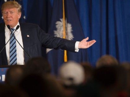 Republican presidential candidate Donald Trump reads from a statement about Pope Francis d