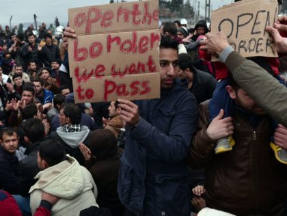 Syrian and Iraqi refugees trapped at the Greek-Macedonian border protest demanding the opening of the borders on February 28, 2016. More than 5,000 people were trapped at the Idomeni camp after four Balkan countries announced a daily cap on migrant arrivals. Slovenia and Croatia, both EU members, and Serbia and …