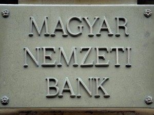 BUDAPEST, HUNGARY: A sign for the Hungarian National Bank hangs on the wall of the bank's headquarters in Budapest, 22 October 2004. A long-standing feud between the government and the central bank heated up in Hungary with a proposed legislation that would give the government influence in determining monetary policy, which the bank charges would violate its independence. AFP PHOTO / ATTILA KISBENEDEK (Photo credit should read ATTILA KISBENEDEK/AFP/Getty Images)