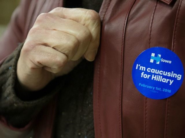 A woman displays her Hillary Clinton sticker at a Democratic Party Caucus at Jackson Township Fire Station on February 1, 2016 in Keokuk, Iowa. Ted Cruz felled long-time Republican frontrunner Donald Trump and Democrat Hillary Clinton was battled into a virtual tie with rival Bernie Sanders, as Iowans held the …