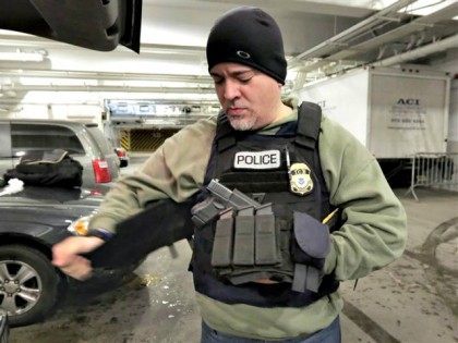 ICE Officer Tacs Up Richard Drew AP