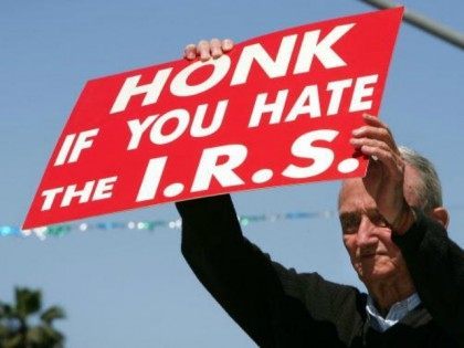 J. D. Montgomery holds a sign on the street outside of the James C. Corman Federal Building encouraging motorist to express their anger at the Internal Revenue Service (IRS) on their final day to file 2005 income taxes on April 17, 2006 in Van Nuys, California. Montgomery says he has …