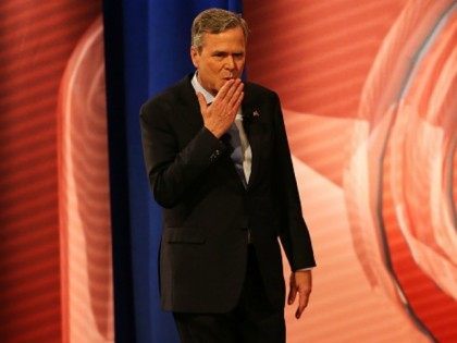 Republican presidential candidate Jeb Bush blows a kiss to his mother as he walks onstage at a CNN South Carolina Republican Presidential Town Hall with host Anderson Cooper on February 18, 2016 in Columbia, South Carolina. The primary vote in South )