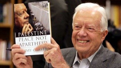 Jimmy Carter Holds book AP
