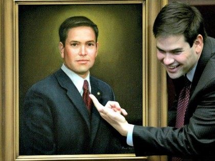 House Speaker Marco Rubio, R-Coral Gables, points to his official portrait that will hang