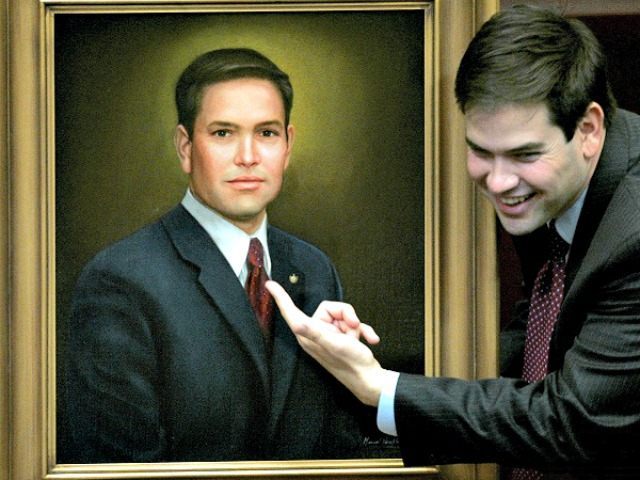 House Speaker Marco Rubio, R-Coral Gables, points to his official portrait that will hang in the House chamber, Friday, May 2, 2008, in Tallahassee, Fla. Rubio is in his final session as House Speaker.(AP Photo/Phil Coale)