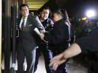 In this photo taken on Tuesday, Feb. 16, 2016, Crystal City Mayor Ricardo Lopez is taken away from city hall by police, in Crystal City, Texas, after allegedly disrupting a City Council meeting while fighting a recall effort that began before his indictment this month in a public corruption investigation …