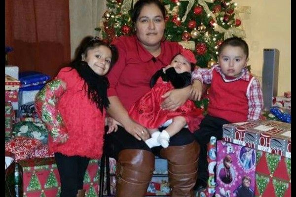 Minerva Cisneros shown with her three children was murdered on Christmas morning. (Photo: GoFundMe page)