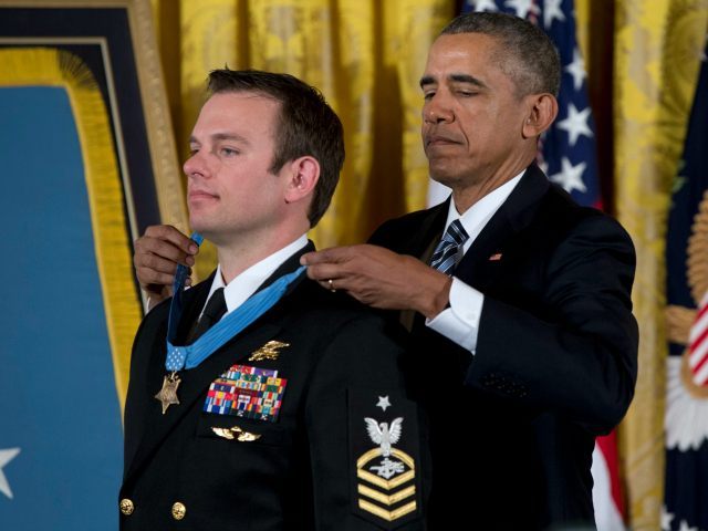 President Barack Obama presents the Medal of Honor to Senior Chief Special Warfare Operato