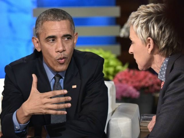 Barack Obama talks to talk show host Ellen DeGeneres during a break in the taping of The E
