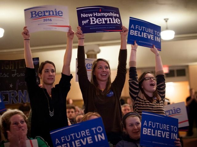 Supporters of Democratic presidential candidate Sen. Bernie Sanders (I-VT) cheer as Sanders speaks at the Claremont Opera House on February 2, 2016 in Claremont, New Hampshire. The New Hampshire primary is February 9. (Photo by