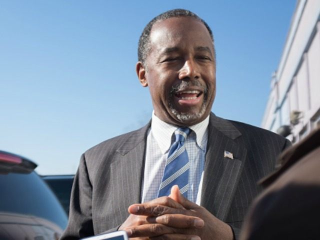 Republican presidential candidate Ben Carson speaks to reporters after stopping at The Air