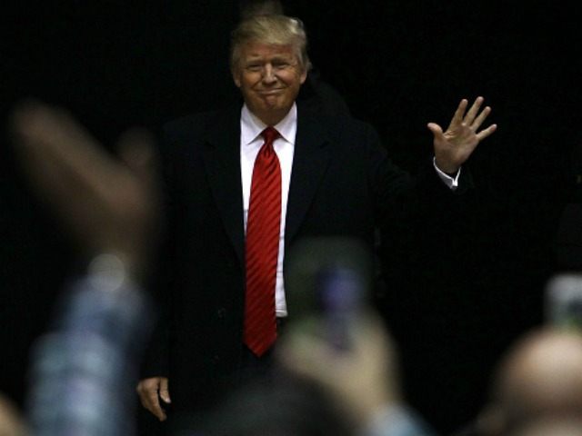 Republican presidential candidate Donald Trump waves before he speaks during a campaign ra