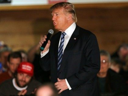 Republican presidential candidate Donald Trump speaks to a small crowd a day before voters