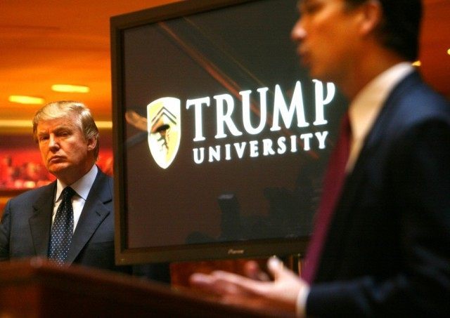 FILE - In this May 23, 2005 file photo, Donald Trump, left, listens as Michael Sexton, pre