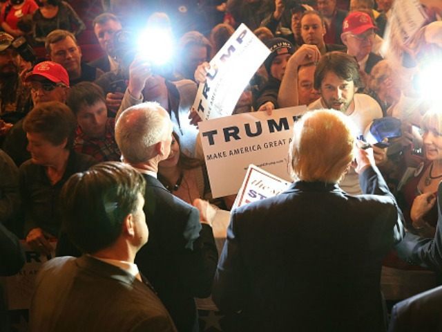 Republican presidential candidate Donald Trump greets people as he attends a campaign rall