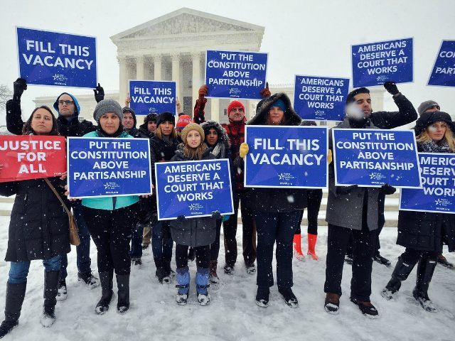 WASHINGTON, DC - FEBRUARY 15: People For the American Way activists rally outside of the S