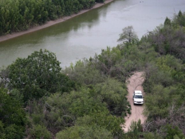 U.S. Border Patrol vehicle searches for drug smugglers near the Rio Grande at the U.S.-Mex