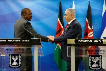 Kenya's President Uhuru Kenyatta (left) shakes hands with Israeli Prime Minister Benjamin Netanyahu in Jerusalem on February 23, 2016
