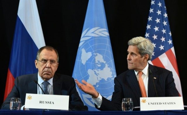 US Secretary of States John Kerry gestures beside the Russian Foreign Minister Sergei Lavr