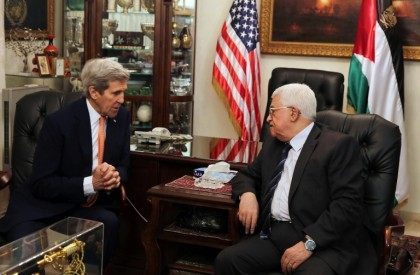 US Secretary of State John Kerry meets with Palestinian President Mahmud Abbas (R) at the