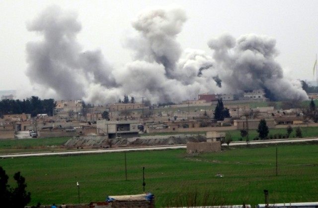 Smoke rises from the Syrian city of Tel Abyad during clashes between Islamic State Group a