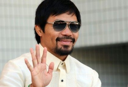 Philippines' eight-time world boxing champion Manny Pacquiao, a former street kid with lit
