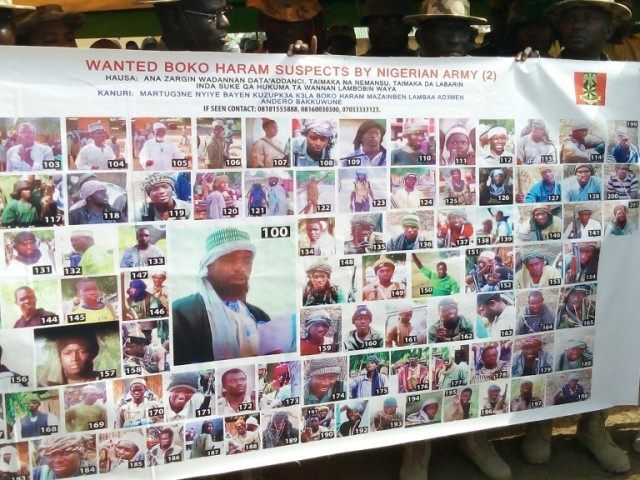 A banner of the 100 most-wanted Boko Haram Islamist suspects released in Damboa on February 27, 2016
