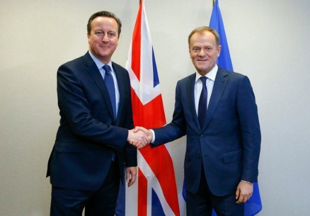 Britain's Prime Minister David Cameron (left) shakes hands with European Council President