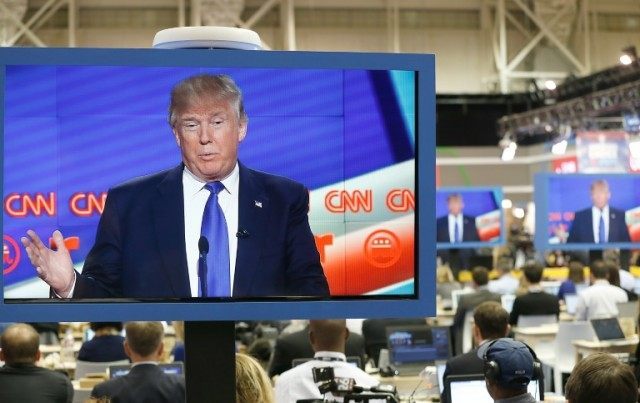 US Republican Presidential Candidate Donald Trump is seen on television in the CNN filing