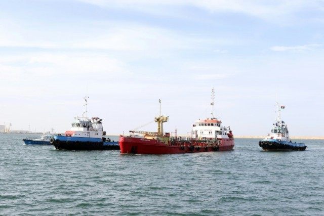 An oil tanker called "Captain Khayyam" is escorted by the Libyan coastguard, at Tripoli's