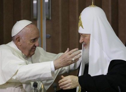 Pope Francis, left, reaches to embrace Russian Orthodox Patriarch Kirill after signing a joint declaration at the Jose Marti International airport in Havana, Cuba, Friday, Feb. 12, 2016. The two religious leaders met for the first-ever papal meeting, a historic development in the 1,000-year schism within Christianity. (AP Photo/Gregorio Borgia, …