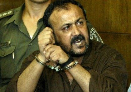 Marwan Barghouti, 43, (R), general secretary of Palestinian [President Yasser Arafat's Fatah ] movement in the West Bank, speaks to the press as his attourney Jamal Bulous (L) tries to stop him at Tel Aviv's city court on August 14, 2002. Shouting in Hebrew, "the Intifada will win", Marwan Barghouti …