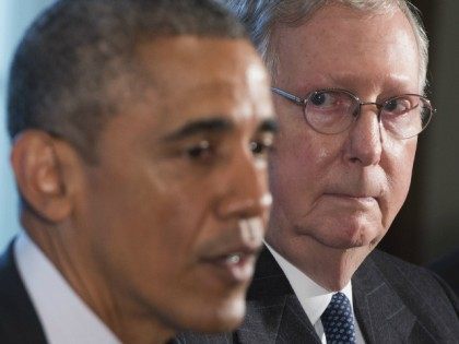 US President Barack Obama speaks alongside Senate Majority Leader Mitch McConnell (R), Rep