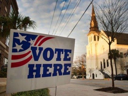 A 'vote here 'sign stands outside a polling station across from the Emanuel African Methodist Episcopal Church in Charleston, South Carolina, on February 20, 2016.