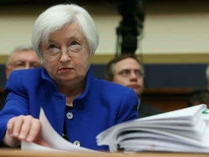Federal Reserve Board Chairwoman, Janet Yellen looks over her papers during a House Financ