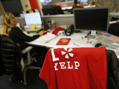 An employee works in the Yelp Inc. offices in Chicago, Illinois, March 5, 2015. REUTERS/JIM YOUNG