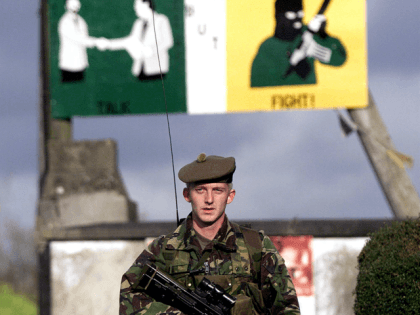A British soldier patrols October 24, 2001 in the village of Crossmaglen, Northern Ireland. Four British Army security installations are to be dismantled in the wake of disarmament by the Irish Republican Army.