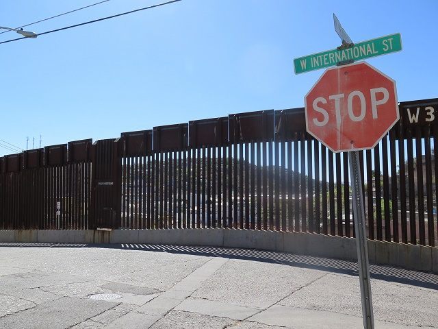 This March 9, 2016 photo shows a stop sign in front of the international border fence in N