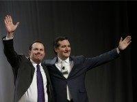 AP_Lee-Cruz Sen. Mike Lee, R-Utah, left, and Sen. Ted Cruz, R-Texas, greet the audience during a rally at the Western Republican Leadership Conference Friday, April 25, 2014, in Sandy, Utah.
