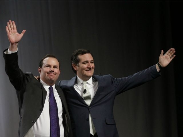 Sen. Mike Lee, R-Utah, left, and Sen. Ted Cruz, R-Texas, greet the audience during a rally at the Western Republican Leadership Conference Friday, April 25, 2014, in Sandy, Utah.
