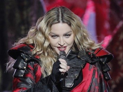 FILE - In this Feb. 20, 2016 file photo, Madonna performs during the Rebel Heart World Tour in Macau, China. Madonna says she would never perform at a concert high or drunk in an Instagram post early Tuesday, March 15, 2016. The pop star played off the reported rumors that …