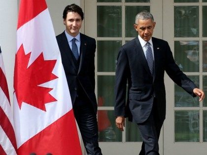 U.S. President Barack Obama and Canadian Prime Minister Justin Trudeau walk from the Oval