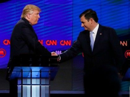 Donald Trump (L) shakes hands with Texas Senator Ted Cruz (R) following the CNN Republican Presidential Debate March 10, 2016 in Miami, Florida.