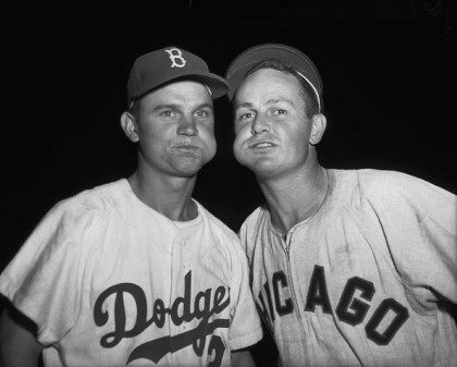 Nelson Fox of the Brooklyn Dodgers and Don Zimmer of the Chicago White Sox chewing tobacco
