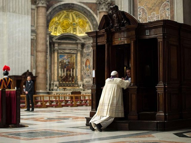 A priest hears confession from Pope Francis during a penitential liturgy in St. Peter's Basilica at the Vatican in this March 28, 2014, file photo. (CNS photo/L'Osservatore Romano via Reuters) See VATICAN-LETTER-CONFESSION March 3, 2016.