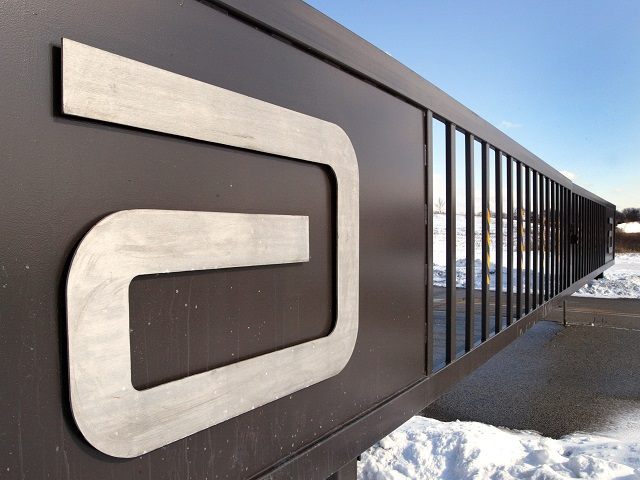 ABBOTT PARK, IL - FEBRUARY 10: An Abbott Laboratories logo is visible on a security gate n