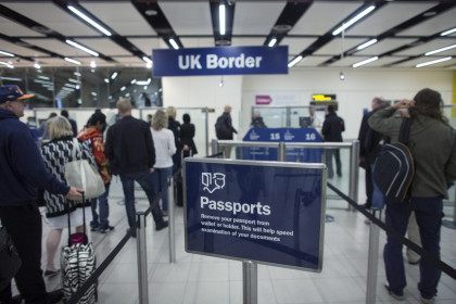 LONDON, ENGLAND - MAY 28: Border Force check the passports of passengers arriving at Gatw