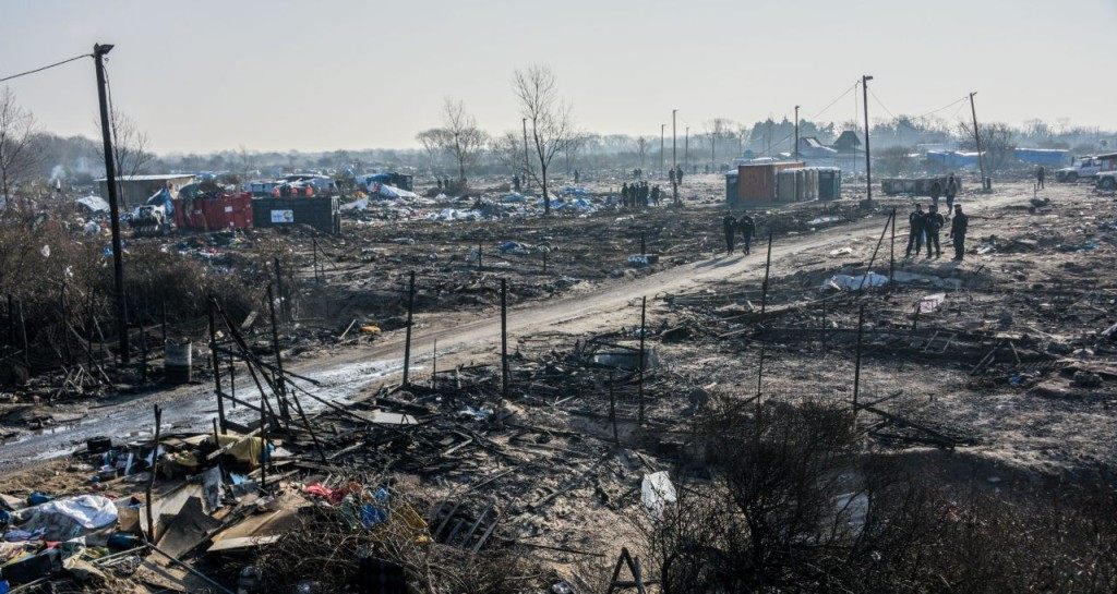 TOPSHOT - A general view taken on March 14, 2016 shows the southern part of the so-called 'Jungle' migrant camp during the dismantling in Calais, northern France. Thousands of migrants have been living in the Jungle and other smaller camps along the northern coast, desperate to reach Britain where many have family or community ties and see better hopes of gaining employment or education. / AFP / DENIS CHARLET (Photo credit should read DENIS CHARLET/AFP/Getty Images)