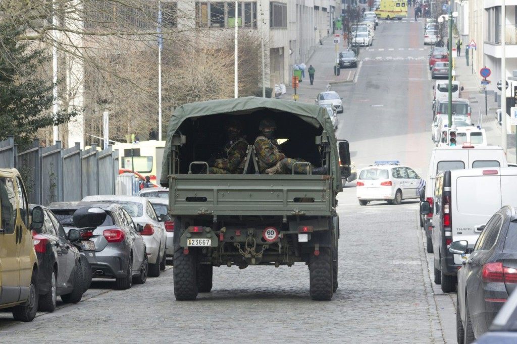 Military personnel arrives at the Rue de la Loi, following its evacuation after an explosion at the Maalbeek subway station in Brussels, on March 22, 2016 A string of explosions rocked Brussels airport and a city metro station on Tuesday, killing at least 13 people, according to media reports, as Belgium raised its terror threat to the maximum level. / AFP / Belga / HATIM KAGHAT / Belgium OUT (Photo credit should read HATIM KAGHAT/AFP/Getty Images)